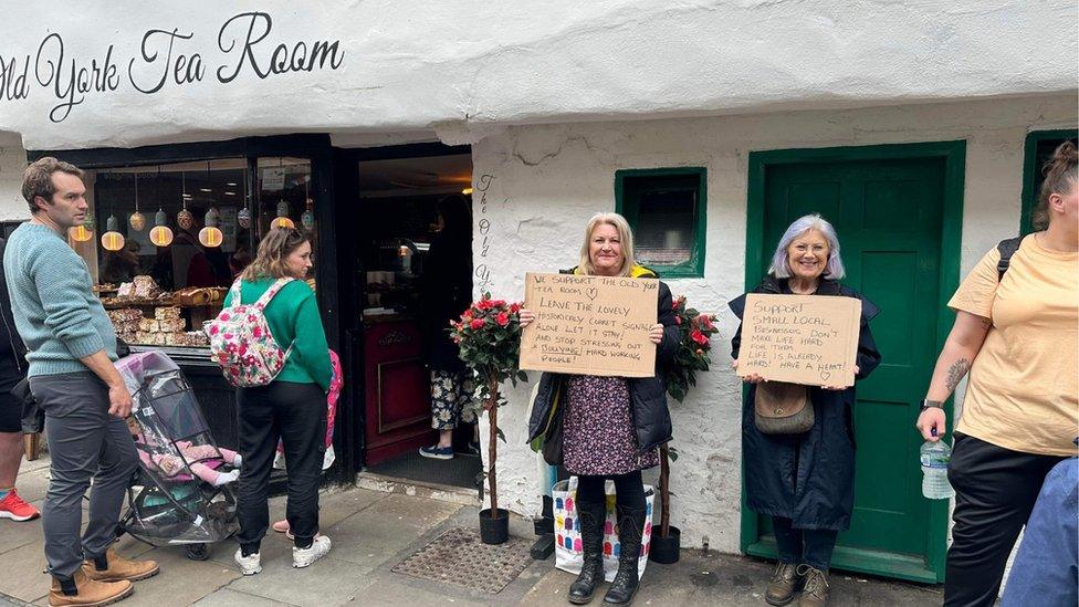 Two women with placards