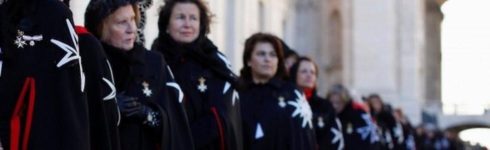 Members of the Order of the Knights of Malta arrive in St. Peter Basilica for their 900th anniversary at the Vatican February 9, 2013