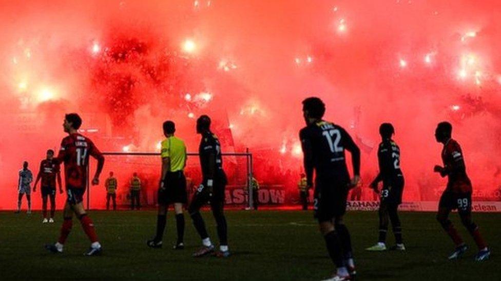 Smoke could be seen bellowing out of the stands at Dens Park