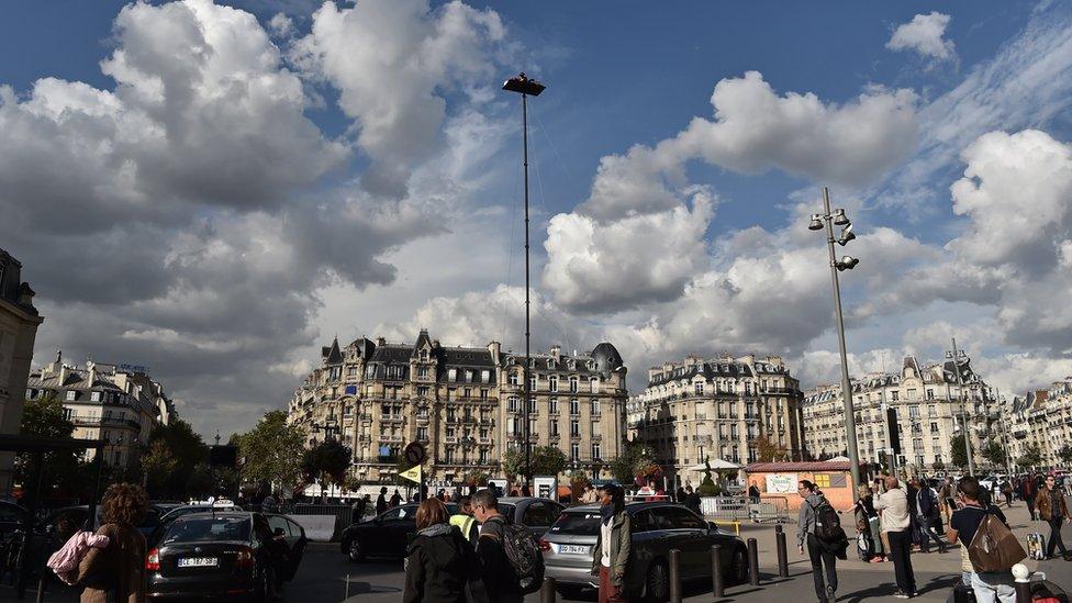 French artist Abraham Poincheval during a week-long stint on top of a pole outside the Gare de Lyon in Paris on 26 September 2016