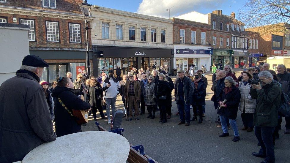 A crowd outside the unveiling of a statue for John Ball