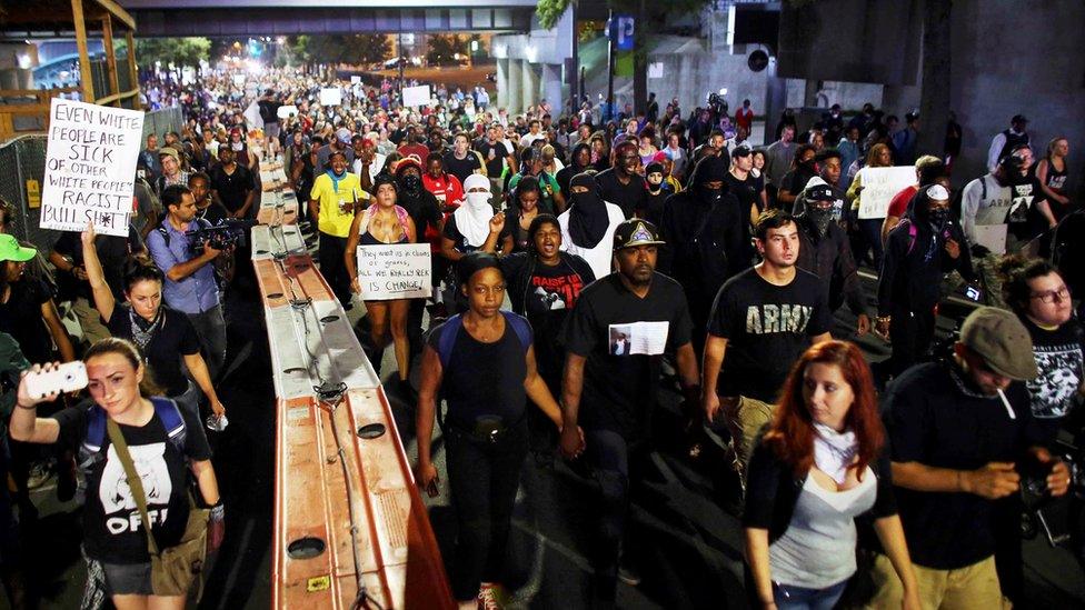 Protestors defied a curfew on Thursday night to protest against the shooting of Mr Scott in Charlotte, North Carolina on September 23, 2016.