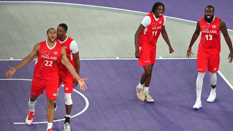 Myles Edward Sinclair Hesson #22, Jamell Anderson #8, Jaydon Kayne Henry-Mccalla #11 and Orlan Jackman #13 of Team England celebrates after defeating Team Australia in the Men's 3x3 Basketball Gold Medal