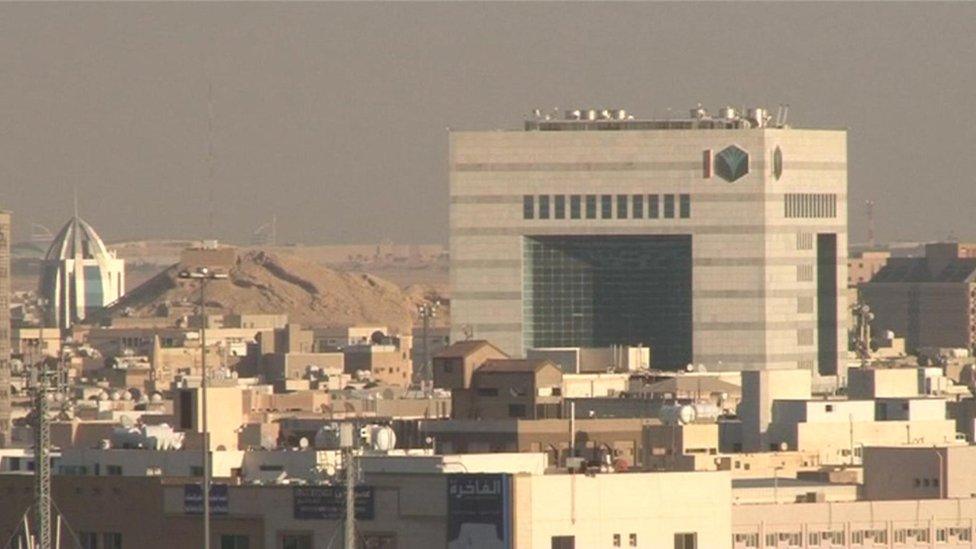 Saudis walking near Justice Square in Riyadh, where executions take place (14 July 2004)