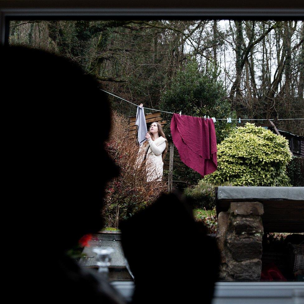 Woman hanging out washing