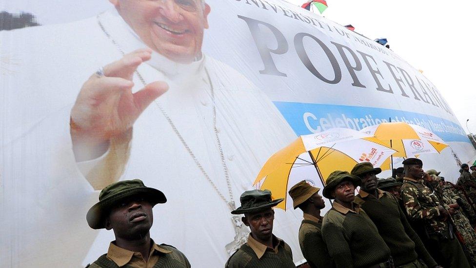 Soldiers patrol during a mass celebrated by Pope Francis on the campus of the University of Nairobi, Kenya