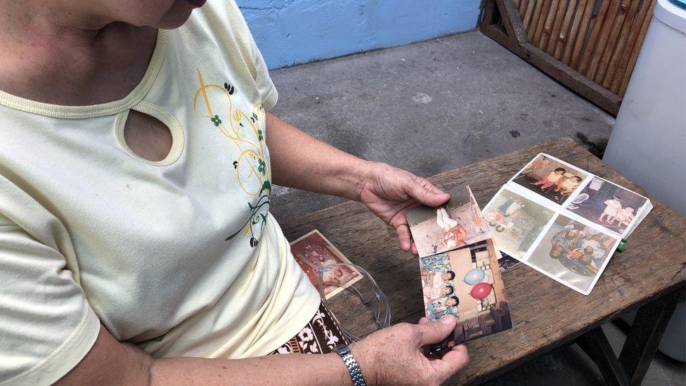 Harry's grandmother looks at photos of him