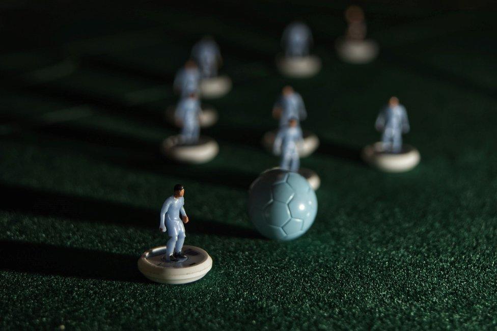 subbuteo players on the pitch