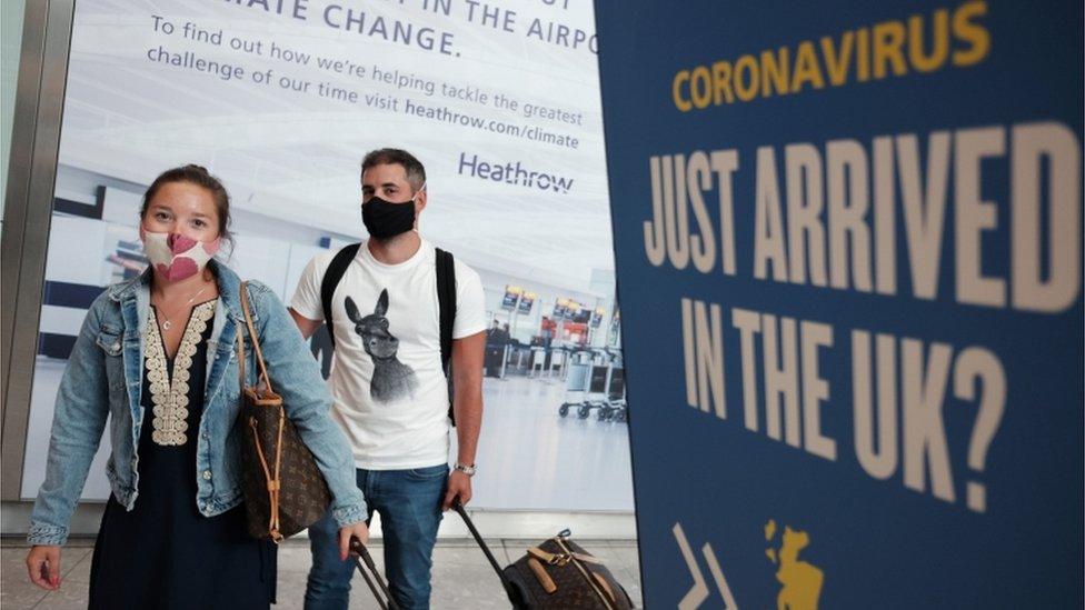 Passengers arrive at Heathrow Airport from Mykonos