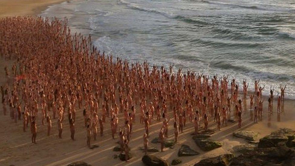 People pose naked on Bondi Beach, Australia