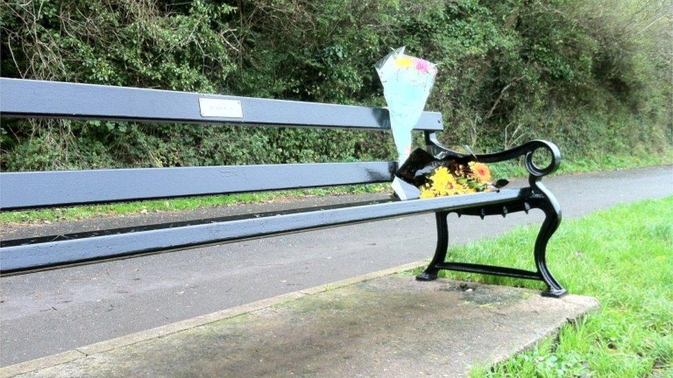 A memorial bench where Robert Mansfield entered the water