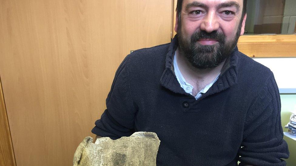 Martin Carruthers hold whale vertebra