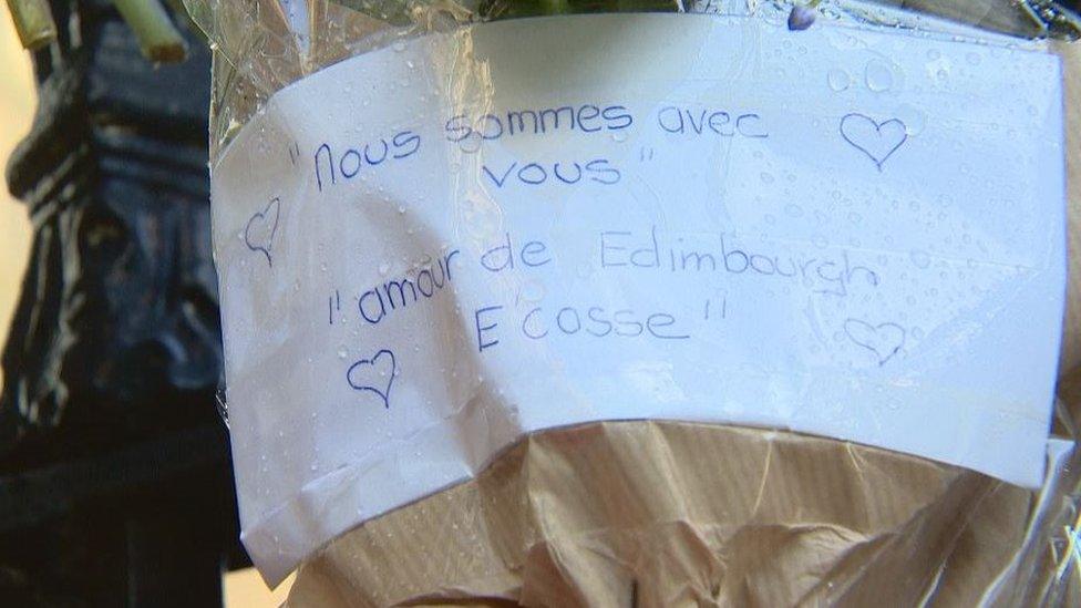 Flowers and messages of support have been left outside the French Consulate in Edinburgh