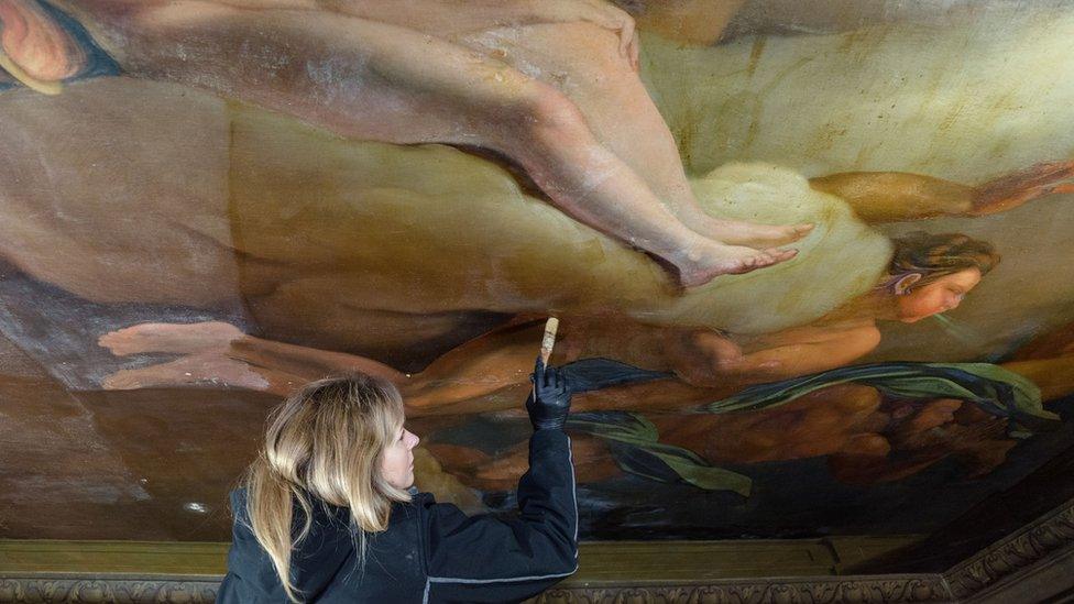 Conservator Marta Sledz working on ceiling painting at Boughton House