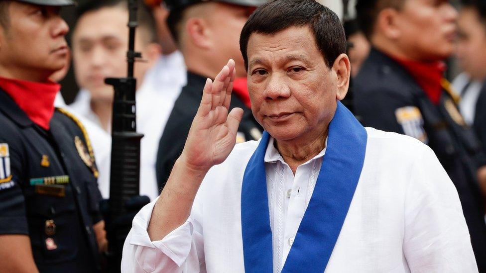 Rodrigo Duterte reviews an honour guard at the Bureau of Customs in Manila, Philippines, 6 February 2018