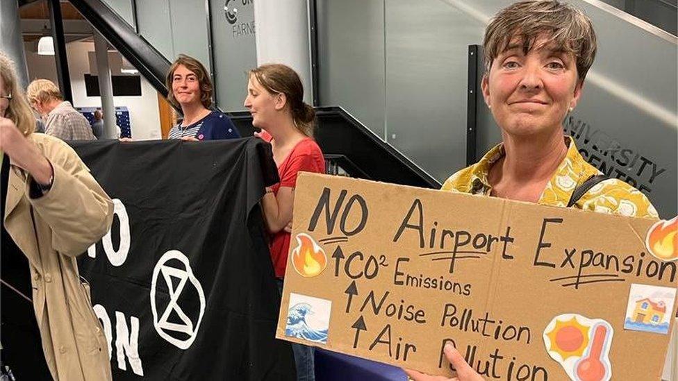 Members of Extinction Rebellion at an airport drop-in event in Farnborough on 20.9.23