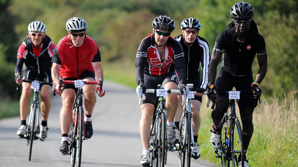 Men on bicycles