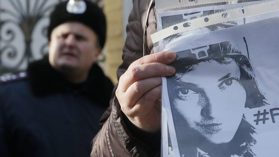 Ukrainian activists hold placards with portraits of Nadia Savchenko during rally in Kiev, Ukraine. 29 January 2016