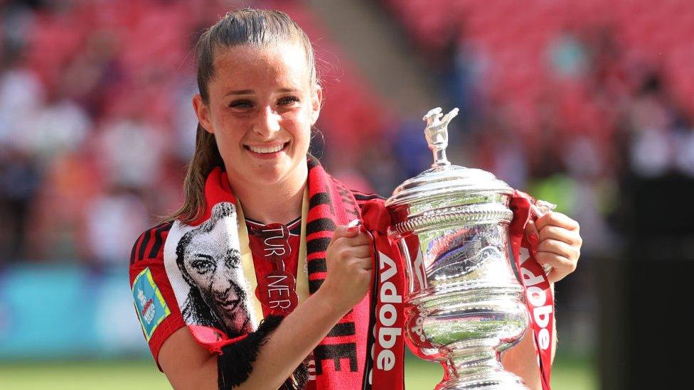 Ella Toone holding fa cup trophy