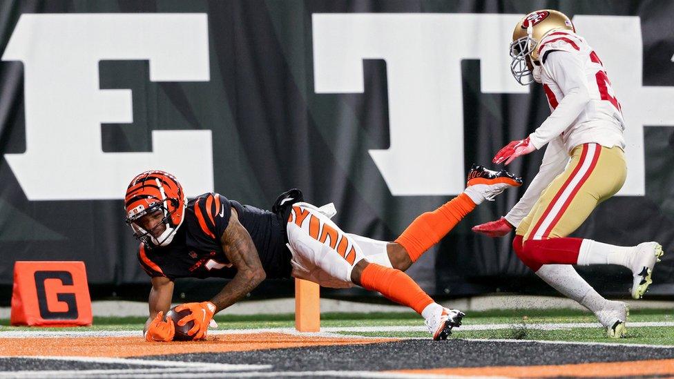 Ja'Marr Chase of the Cincinnati Bengals attempts to make a catch while being guarded by Ambry Thomas