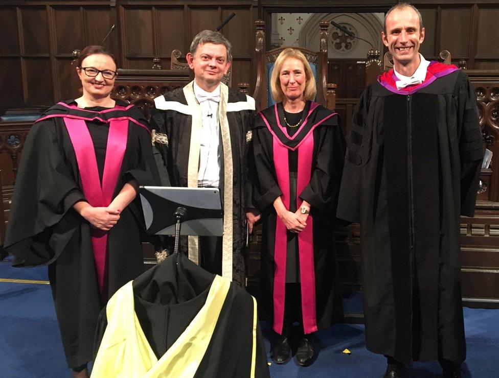 Senior Glasgow University staff with the robot