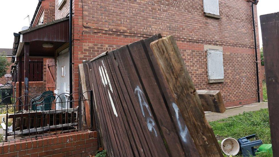 Image of property in St James Court, Grangetown which was subject to a closure order by magistrate showing rubbish and boarded up windows