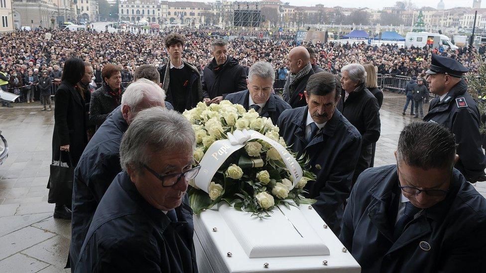 The coffin of Giulia Cecchettin is carried inside the Santa Giustina Basilica during her funeral in Padua, northern Italy, 05 December 2023.