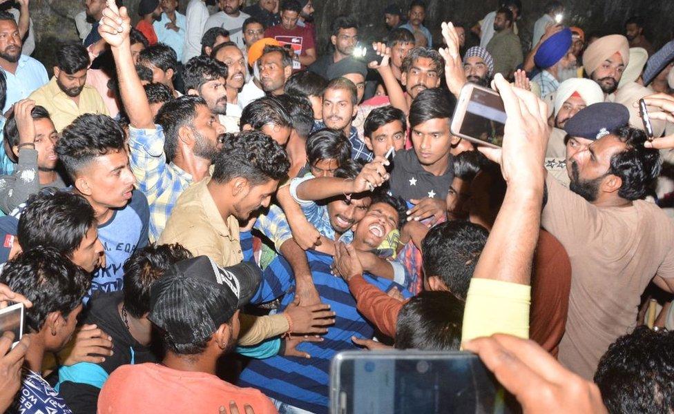 People mourn the demise of their relatives due to the accident on 19 October 2018 in Amritsar.