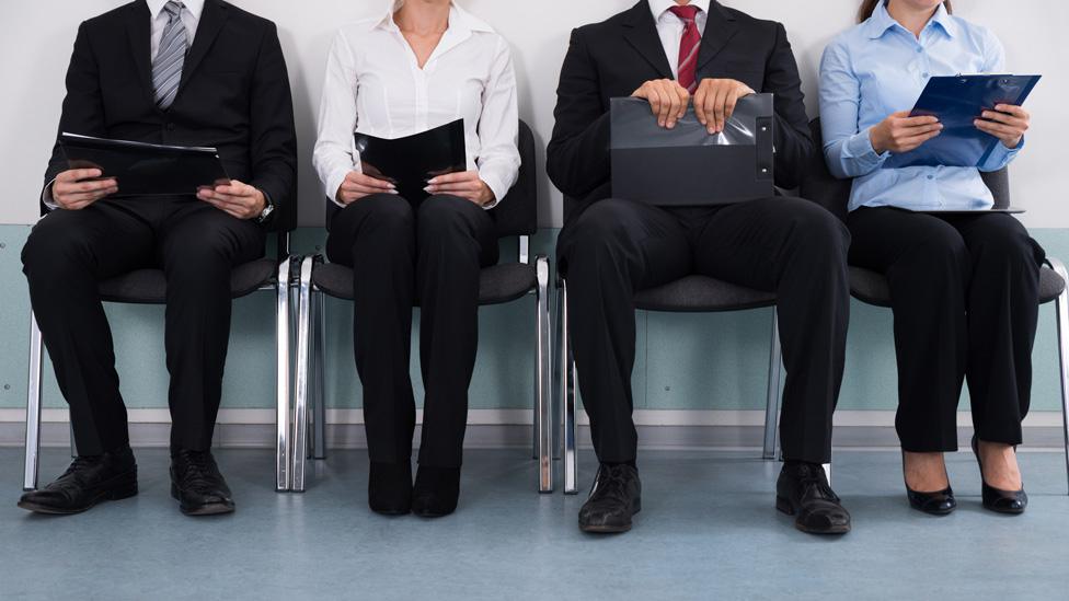 Job interview line (stock image)