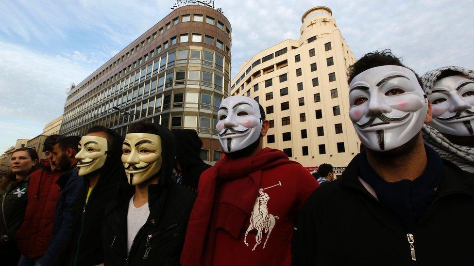 Masked Lebanese protesters take part in demonstration against rubbish crisis and government corruption, in Beirut, on March 12, 2016