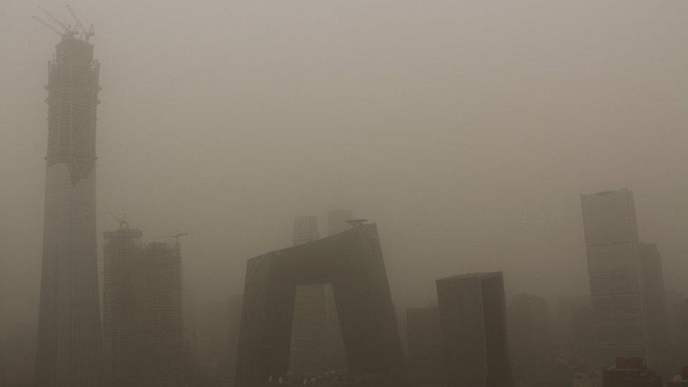 Buildings are seen during a dust storm in Beijing, China, 4 May 2017