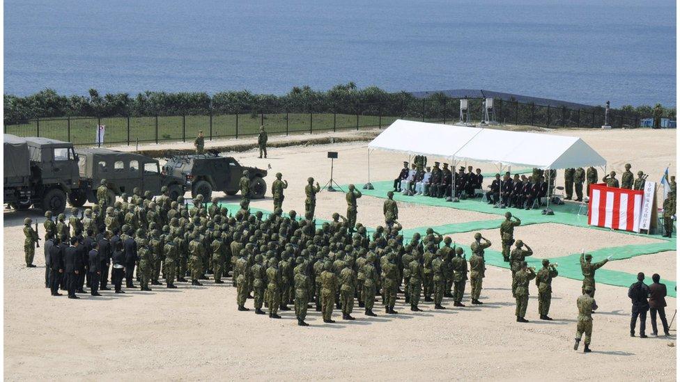 View of dozens of Japanese troops holding the opening ceremony of a new military base on the island of Yonaguni, in Okinawa prefecture, on 28 March 2016