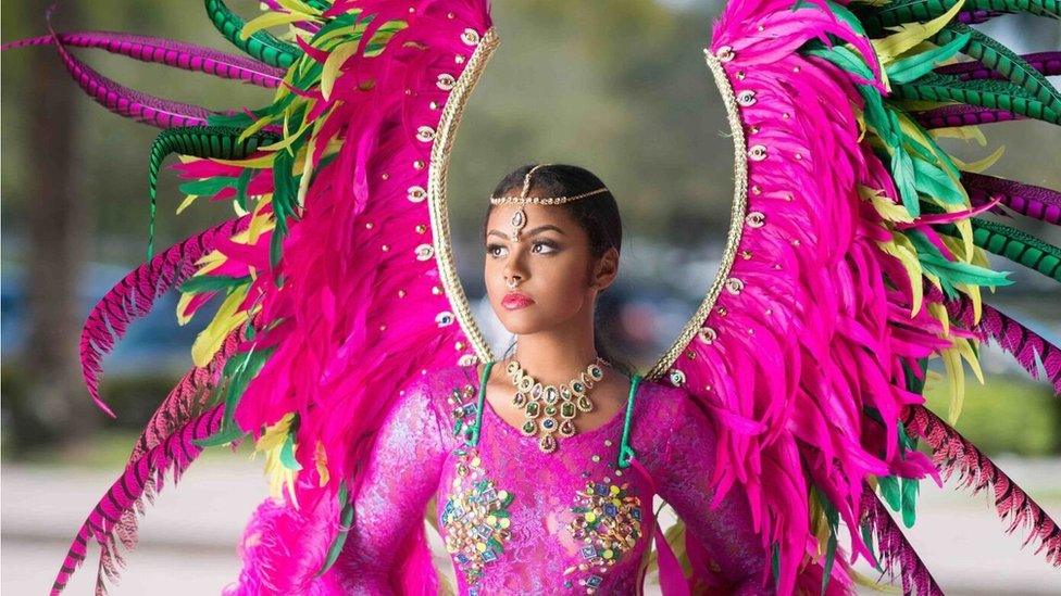 A woman models a costume made by Insane Troupe