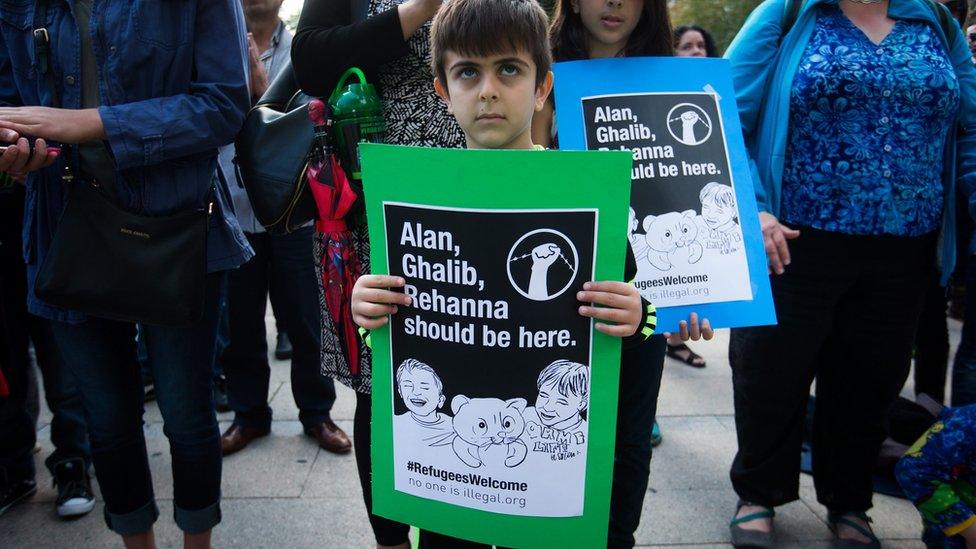 Diyako Salamat, 6, attends a rally in Vancouver asing the government to allow more refugees into the country