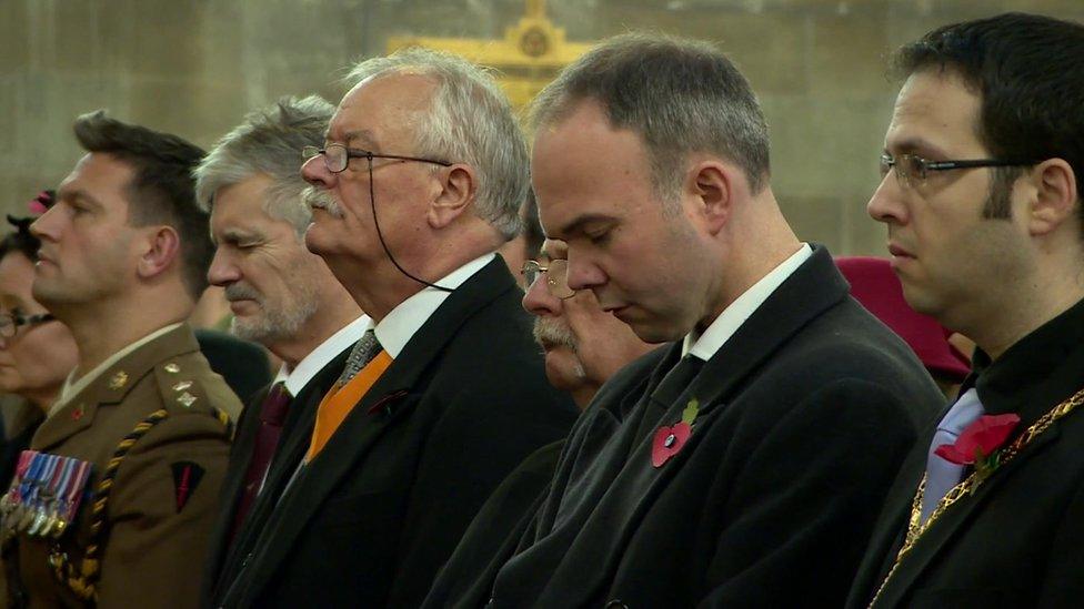 The congregation at Croydon Minster observe a minute's silence for the victims of Wednesday's trams crash