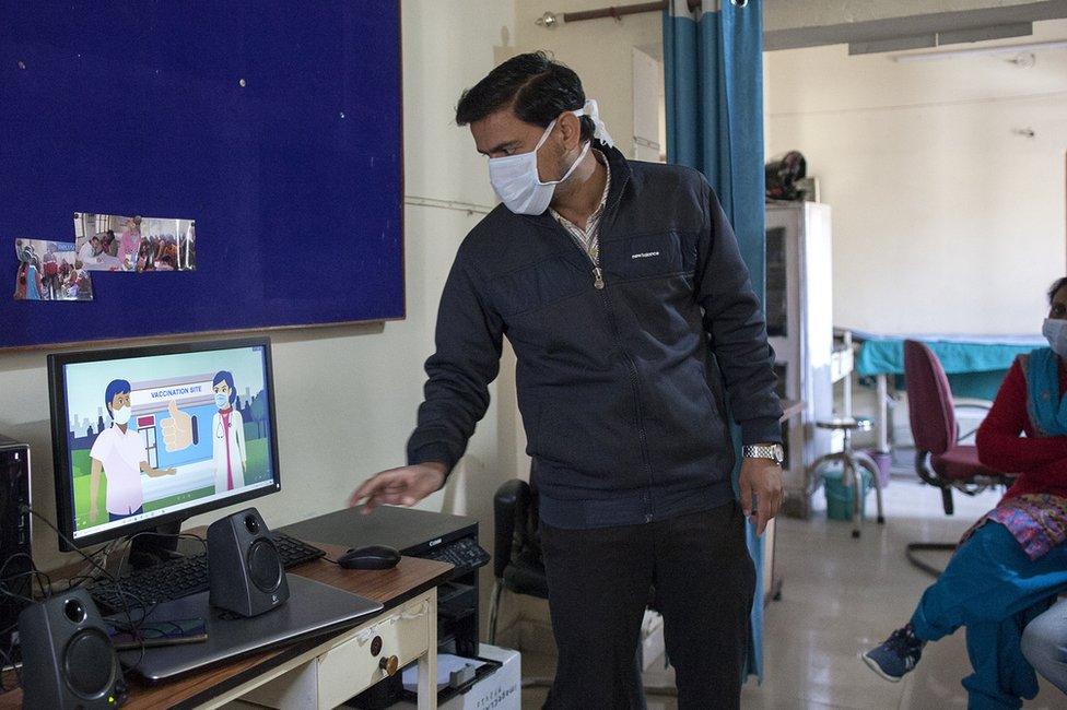 A doctors conducting training for vaccinators and health workers in Uttarakhand