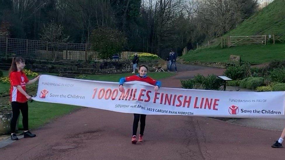 Sienna crossing the finishing line