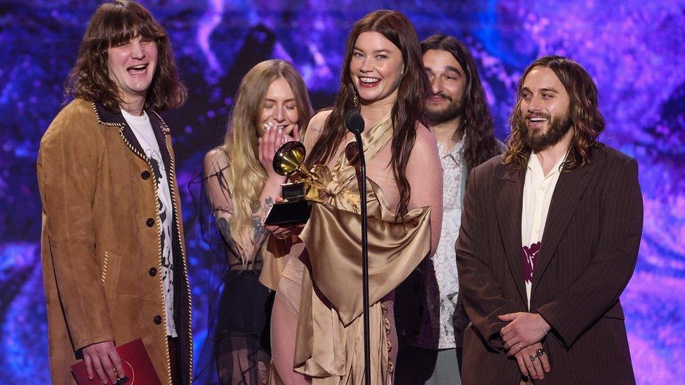 Wet Leg on stage collecting a Grammy Award