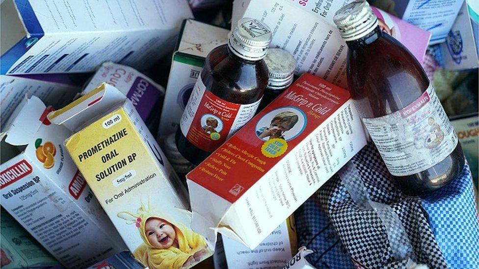 A photograph shows collected cough syrups in Banjul on October 06, 2022. - Indian authorities are investigating cough syrups made by a local pharmaceutical company after the World Health Organisation said they could be responsible for the deaths of 66 children in The Gambia.