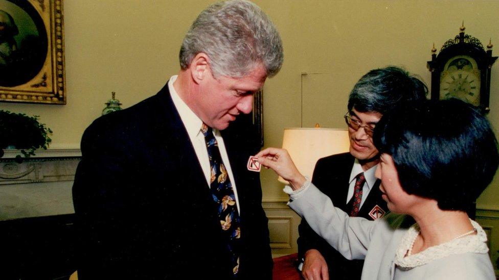 Masa (centre) and Mieko (right) Hattori meeting President Bill Clinton (left) in 1993