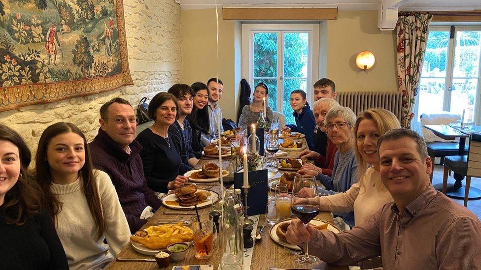 Mr and Mrs Davis family sit around a long table for a celebration lunch at the Methuen Arms, Corsham where the couple celebrated their wedding reception in 1963