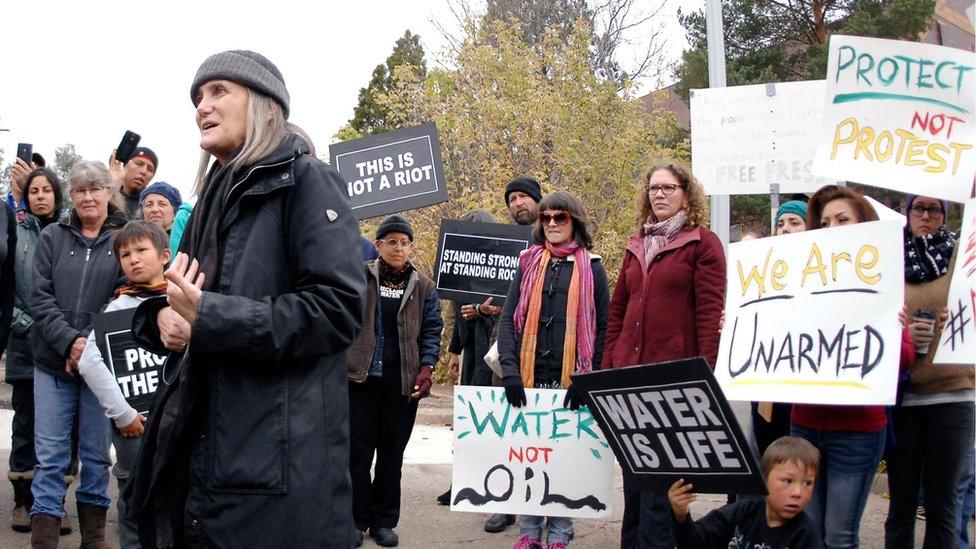 Amy Goodman at protest before hearing riot charge had been dropped