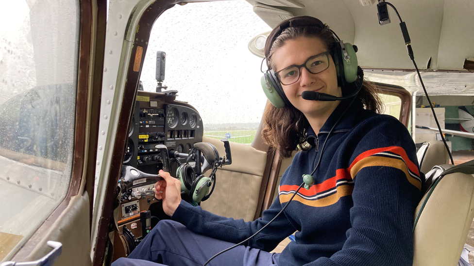 Milo in a cockpit