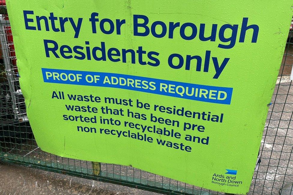 Sign informing residents that they require proof of address