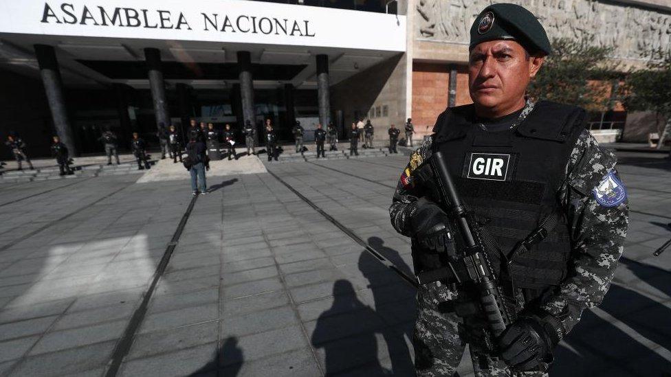 Police and armed forces guard outside the National Assembly in Quito, Ecuador, 17 May 2023.