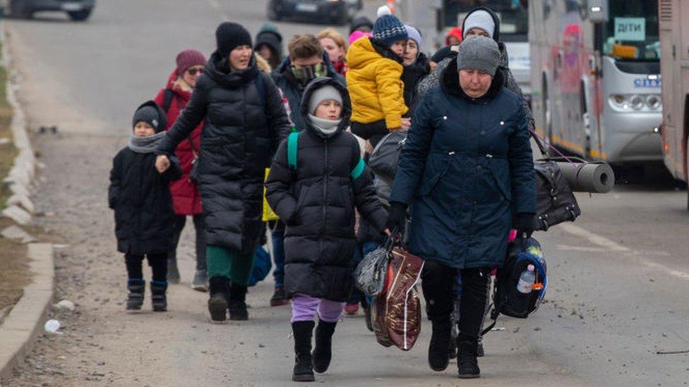 Refugees arriving at the Polish border.