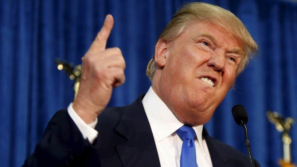 Republican presidential candidate Donald Trump gestures and declares "You"re fired!" at a rally in Manchester, New Hampshire, in this June 17, 2015 file photo.