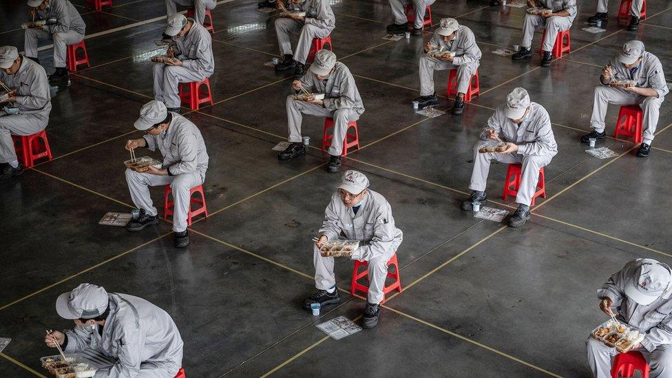 Workers keeping a distance from each other during their lunch break