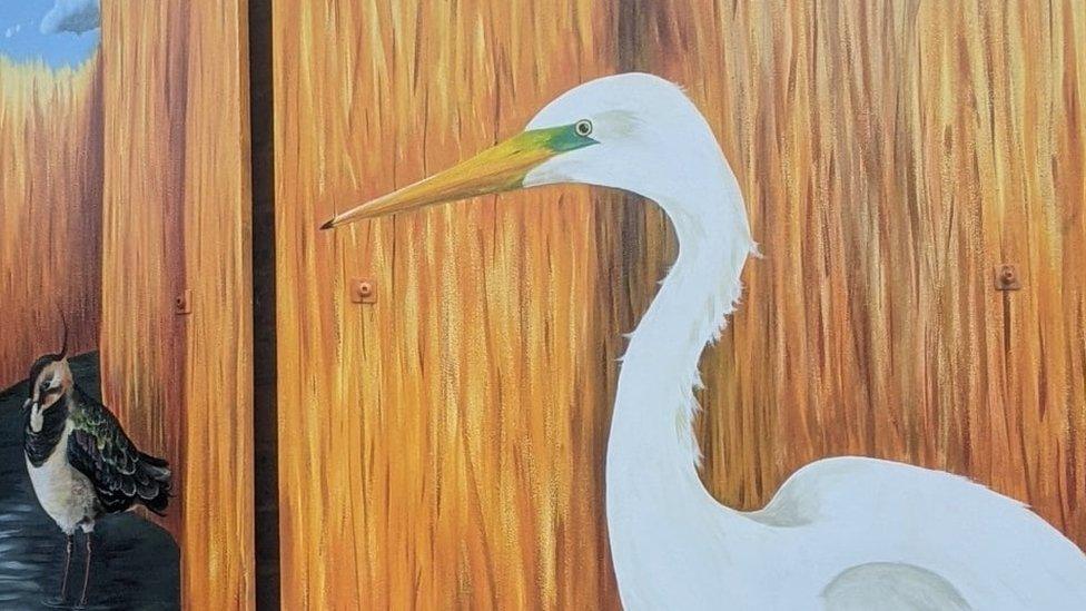 Detail of Birds in the Reeds at Lodmoor mural showing a white heron or egret