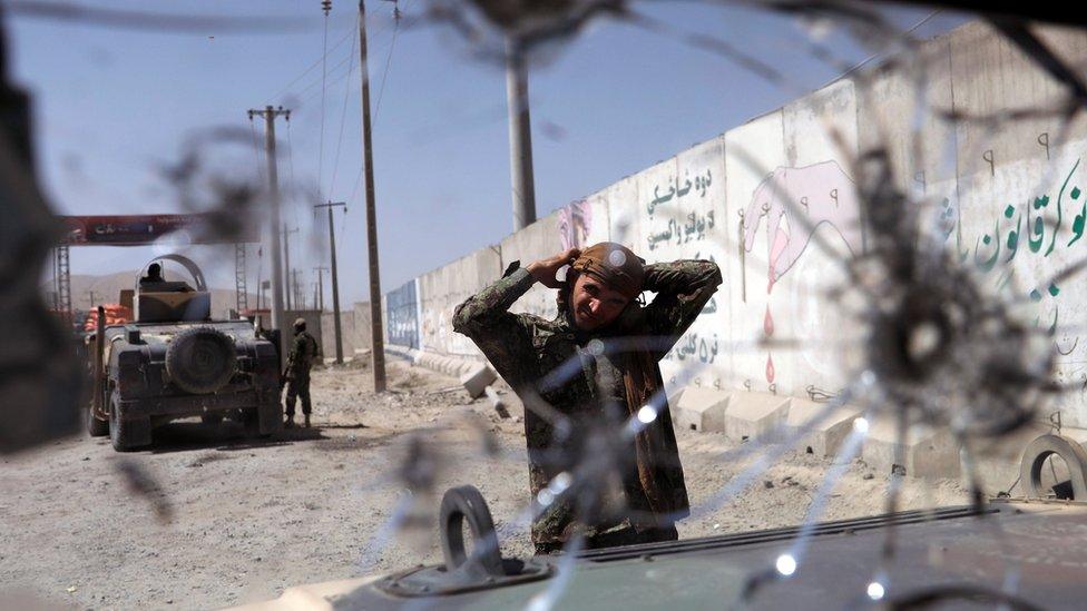 An Afghan National Army (ANA) soldier keeps watch at a checkpoint on the Ghazni - Kabul highway, Afghanistan August 14, 2018.